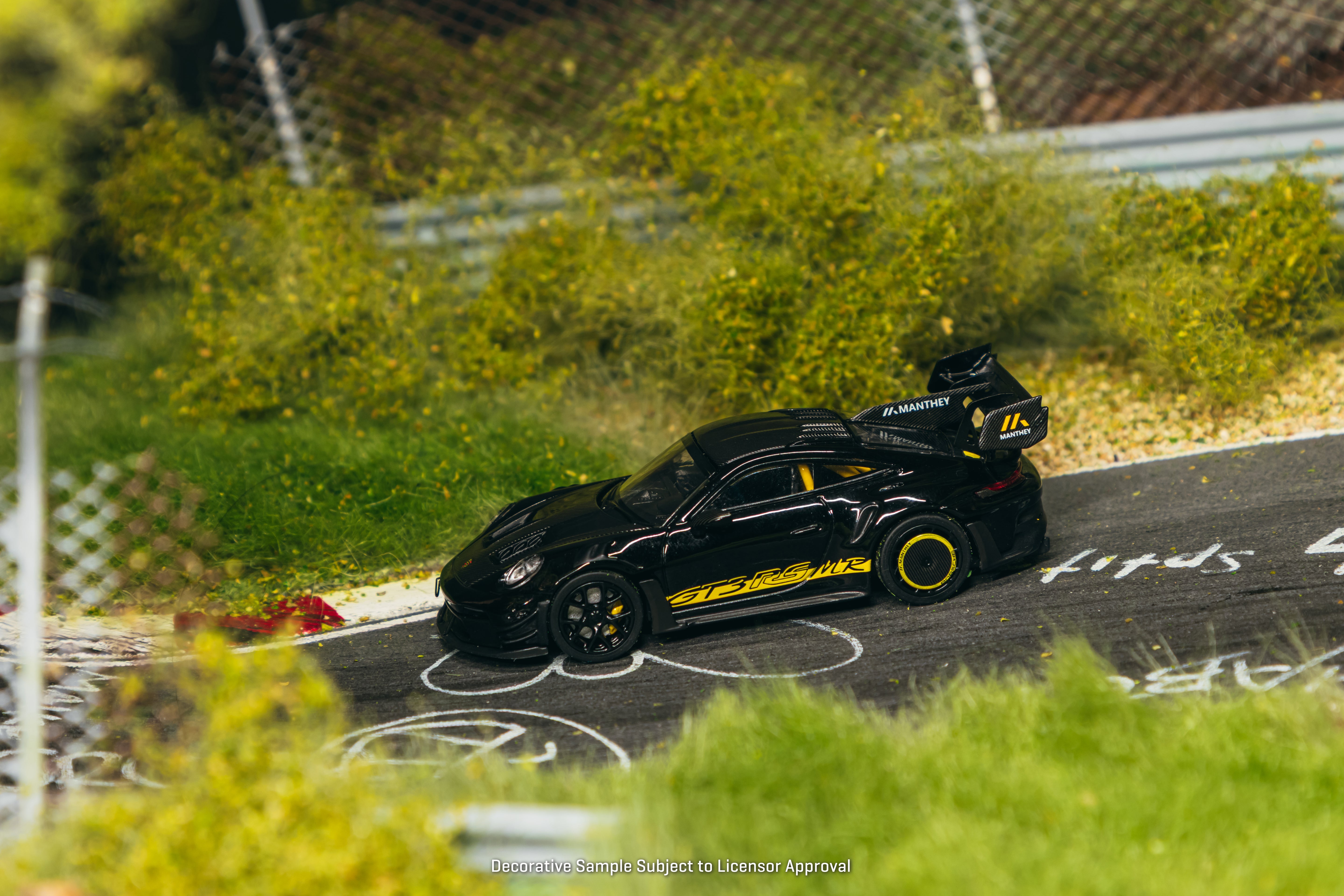 Tarmac Works Minichamps64 — Porsche 992.1 GT3 RS Manthey Racing (Black/Yellow)